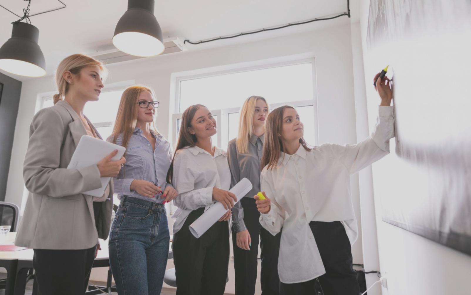 Participant working through personalized budget scenarios on tablet during Oxelumariq workshop
